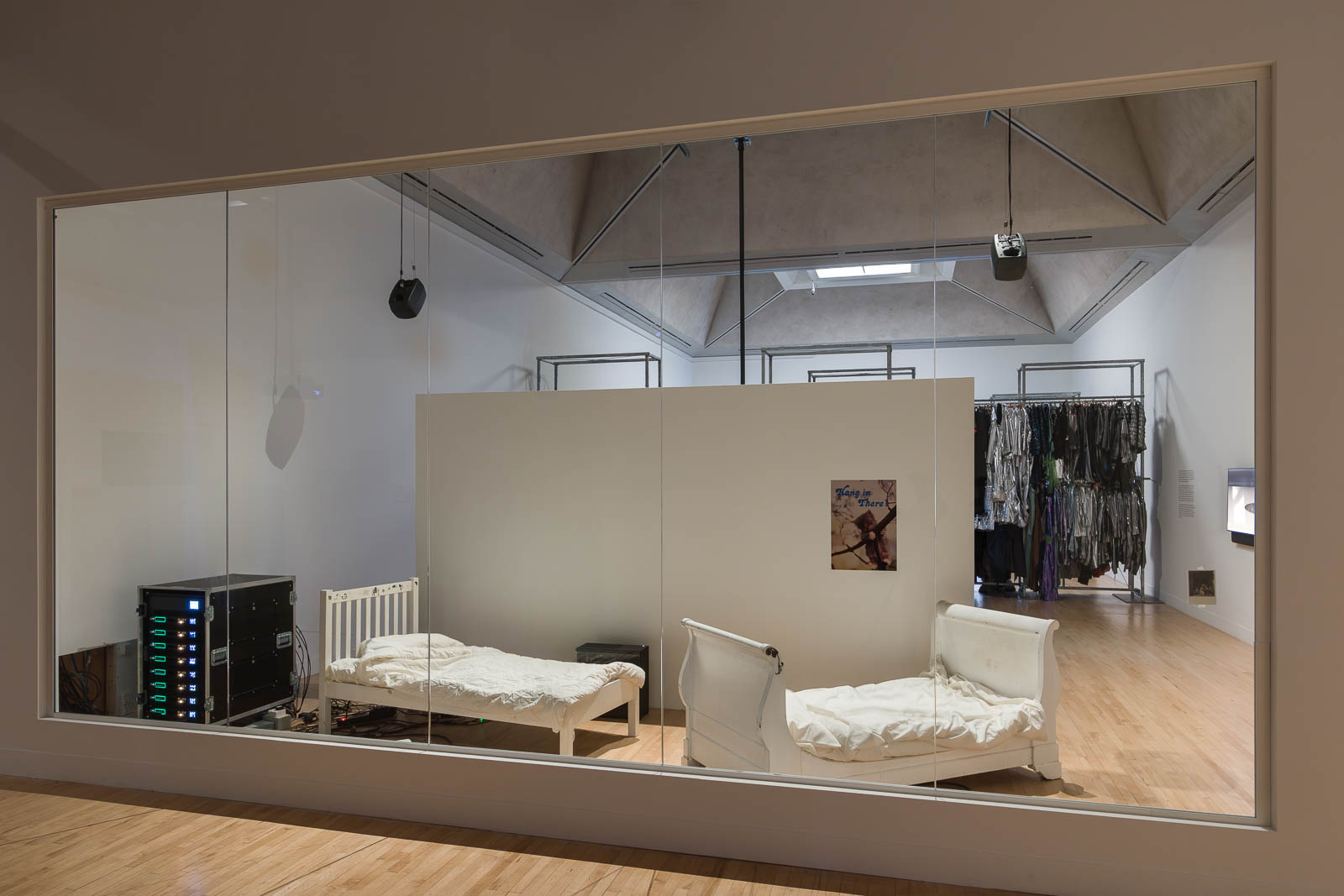 Ed Atkins, Beds, 2025, motor, battery, wooden bed frame, cotton sheets, installation view Tate Britain