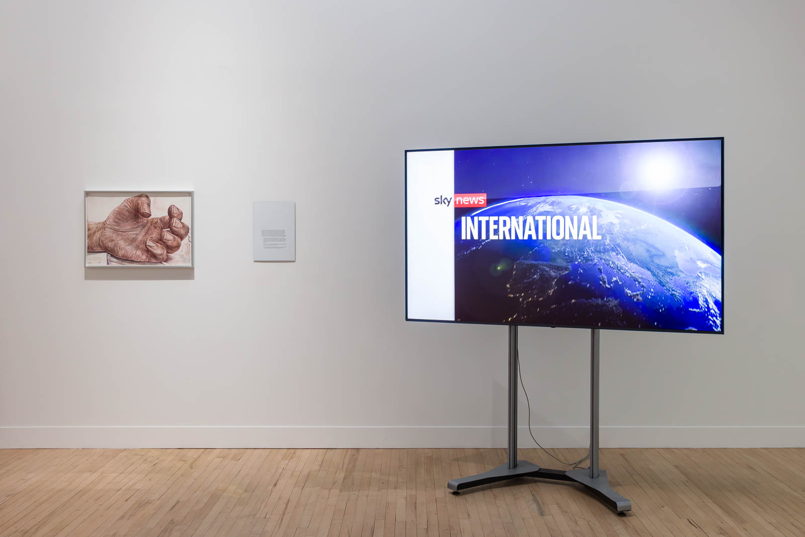 Ed Atkins, Untitled, 2022, ink bleach and pencil on watercolour paper, and Sky News, 2016, video and sound, installation view Tate Britain